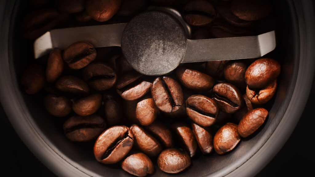 closeup of coffee beans in grinder