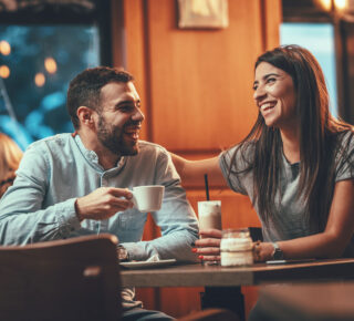 couple drinking coffee at a cafe